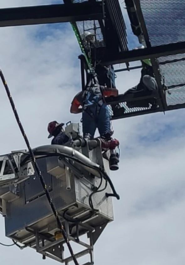 Worker Dangling from Billboard Rescued Without Serious Injury