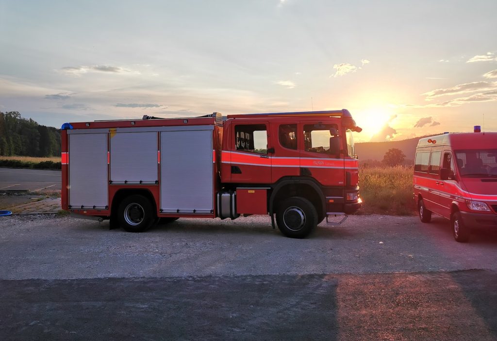 white and red crane truck